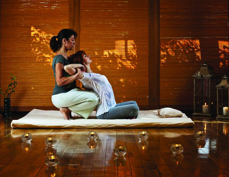 Assisted Thai yoga stretching session